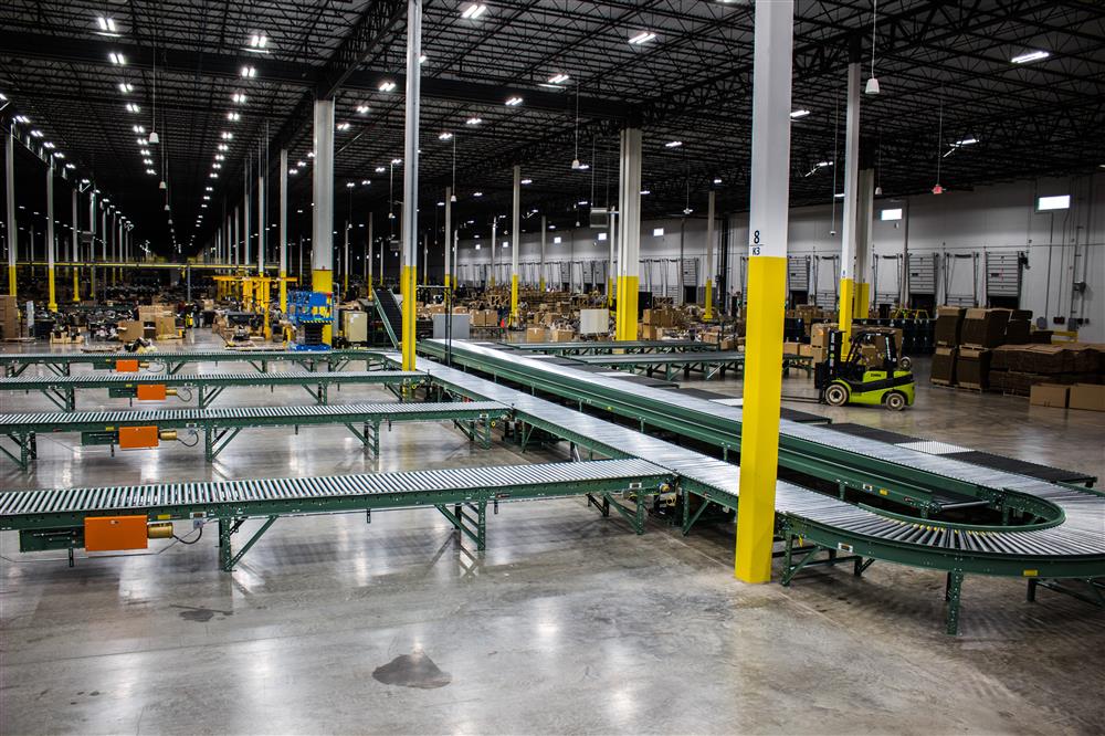 Conveyor discharge lanes with photo eyes