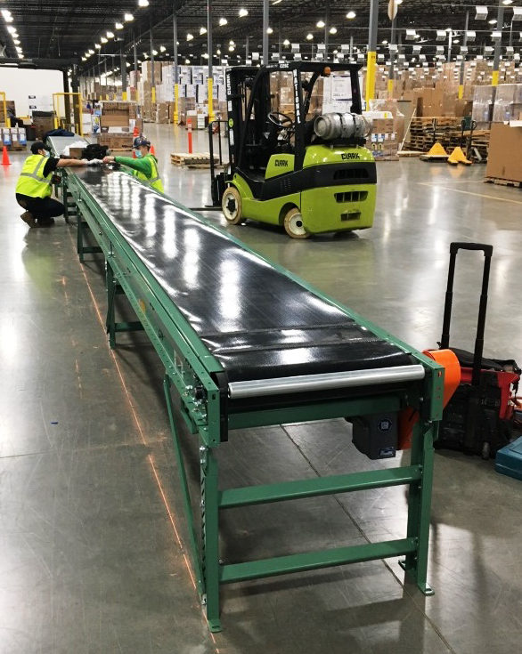 Slider bed belt conveyor at manufacturing facility