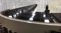 PTM Series Power Turn Belt Curve Conveyor in use.