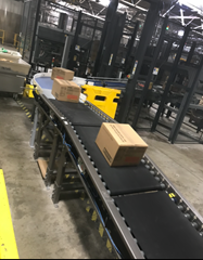 24 volt, zero pressure, zone to zone accumulation Motorized Driven Roller Conveyor which separates and accumulates product onto an automatic palletizer.