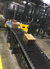 Product is being conveyed onto an automatic palletizer via Motorized Driven Roller (MDR) Conveyor, which separates product to allow zoned accumulation onto the palletizer.