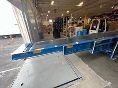 The Telescopic Traversing Truck Unloader is used for easy truck unloading. This unit extends to the back of a 53' truck for ease of unloading. It is mounted on two flush tracks that allows for service to multiple dock doors with only one unit.