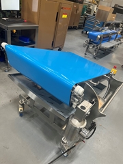 This conveyor is being used to transport raw poultry, pork, and beef to and from an impingement oven.